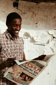 Person reading newspaper
